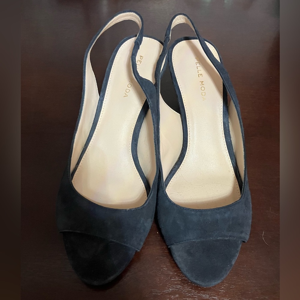 Navy blue open toed sling backs.